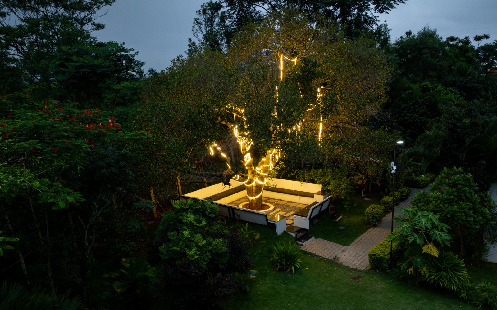 Close aerial view of the lit-up sit-out at dusk